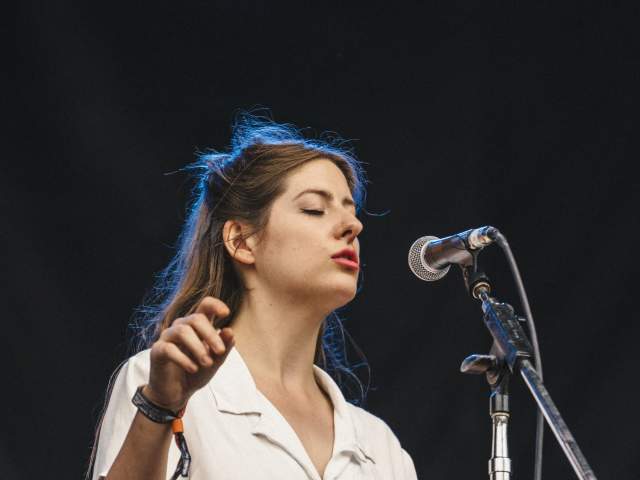 Molly Burch sings on stage at ACL Fest
