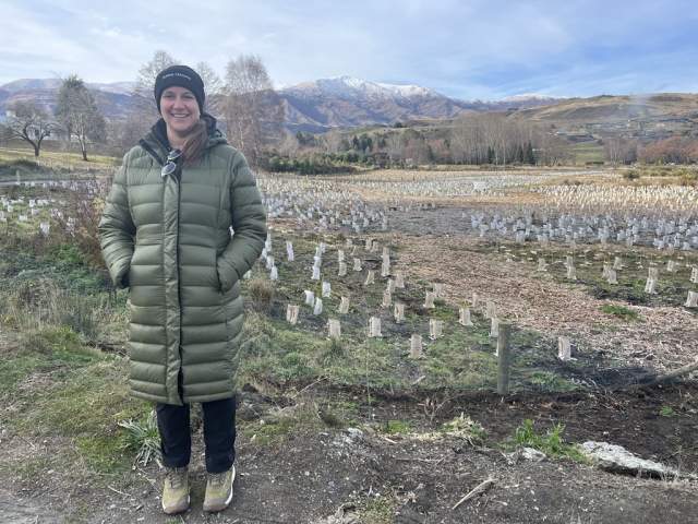 Cora Heister, Mana Tāhuna Taiao Manager, stands at Wai Whakaata Lake Hayes