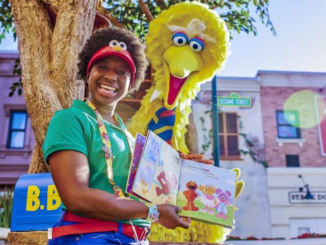 Big Bird reading a book in Sesame Street Land at SeaWorld Orlando