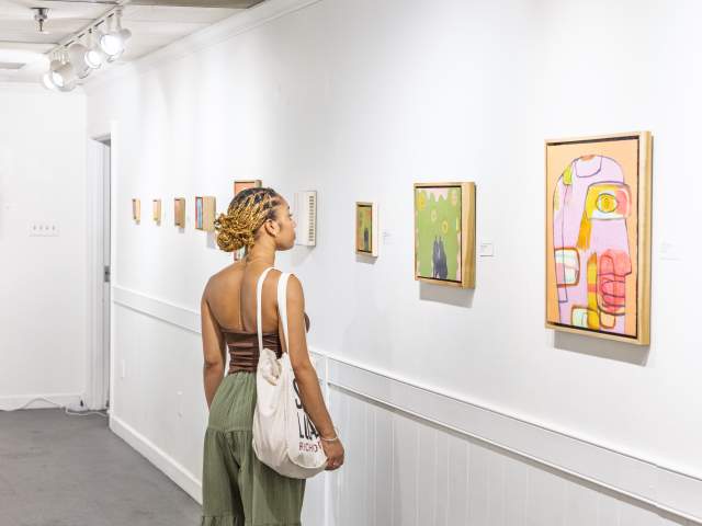 Woman viewing art at ArtWorks