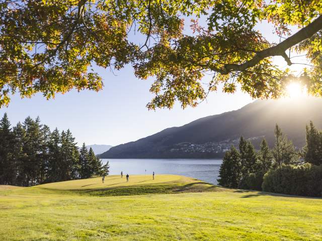 Golfers at Queenstown Golf course in spring
