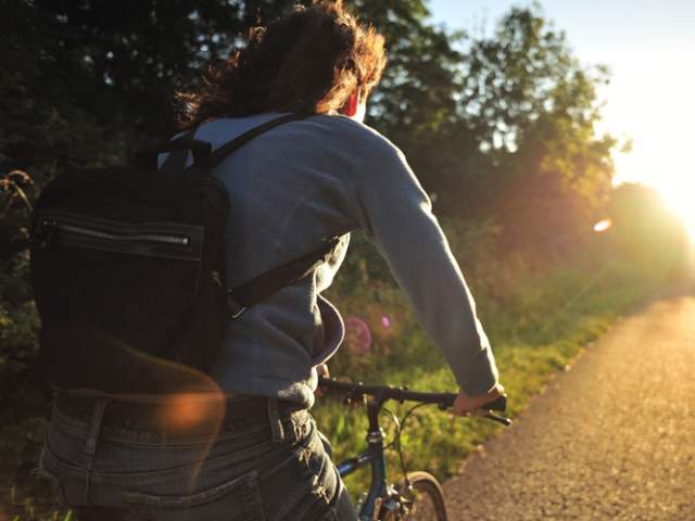 Person cycling on cycle path - credit Sustrans