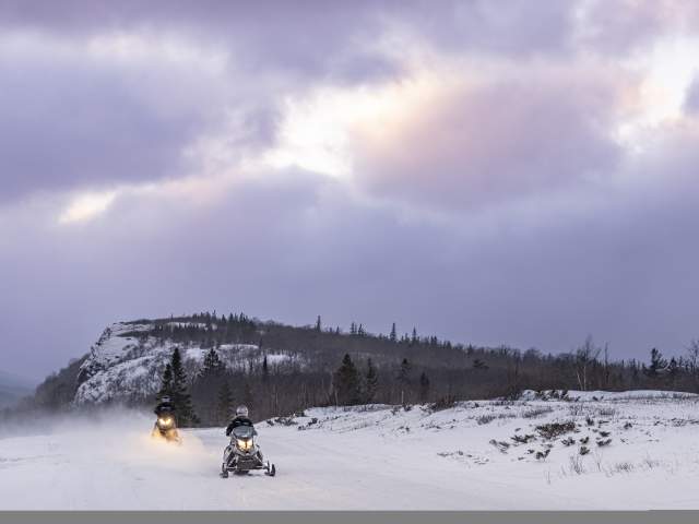 Snowmobiles on trail by Cliff Range