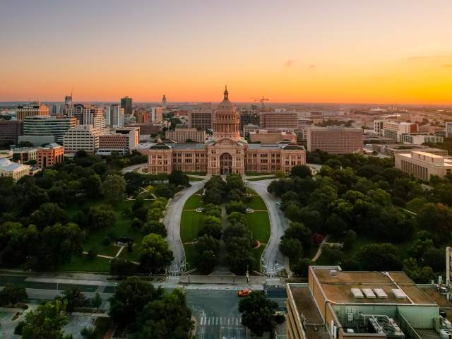 Sunrise aerial view of the Texas State Capitol grounds.