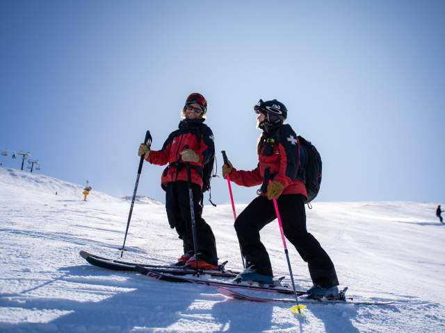 Photo of two people, Sam & Charlotte, Ski Patrol at Coronet Peak