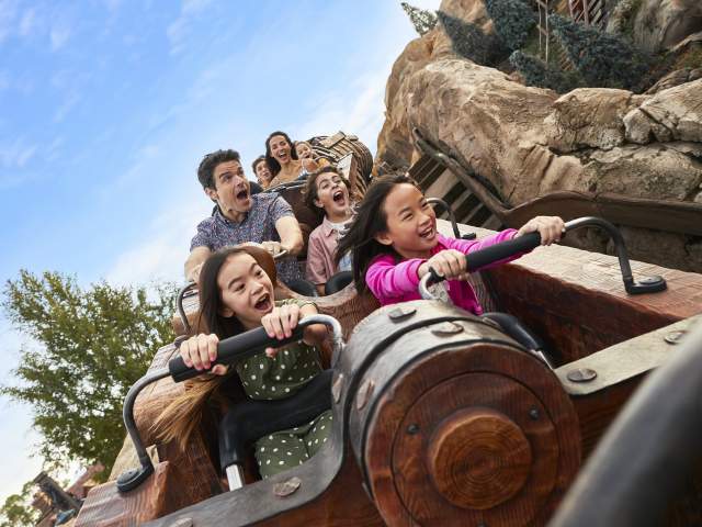 Sisters on the Seven Dwarfs Mine Train Rollercoaster at the Magic Kingdom in the Walt Disney World Resort.