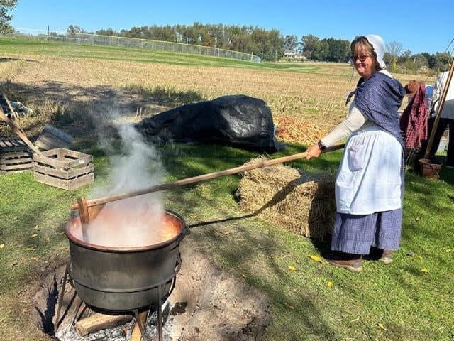 June Moser takes on apple butter stirring duties at Heritage Days.