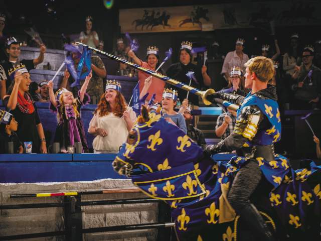 Knight giving favor to girl at Medieval Times Dinner & Tournament