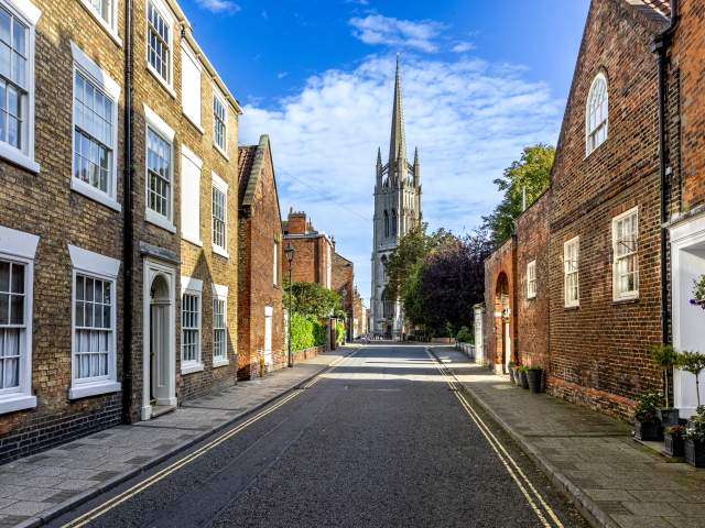 a street in Louth with a church at the end and houses either side