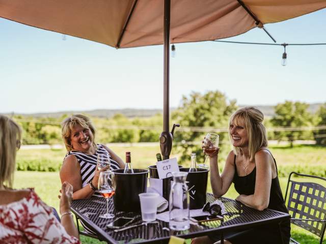 Women eating on terrace of Defiance Ridge Vineyards