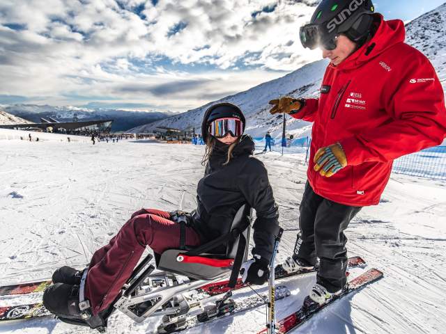 Adaptive skier with instructor at The Remarkables