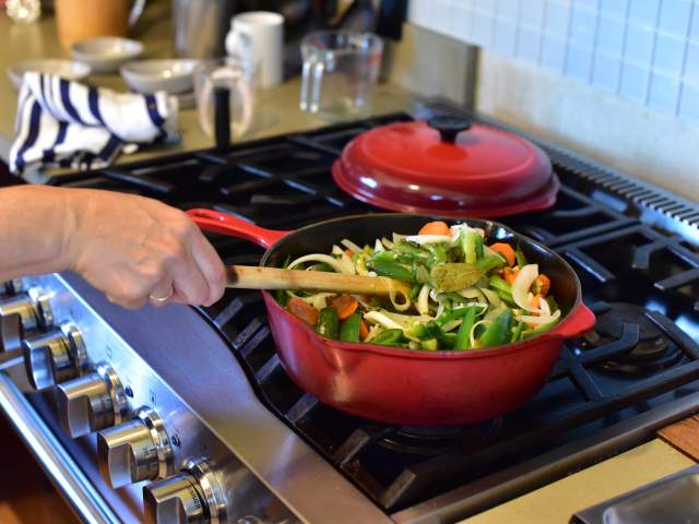 Chef cooking Chiles Jalapeños en Escabeche at El Naranjo in Austin Texas