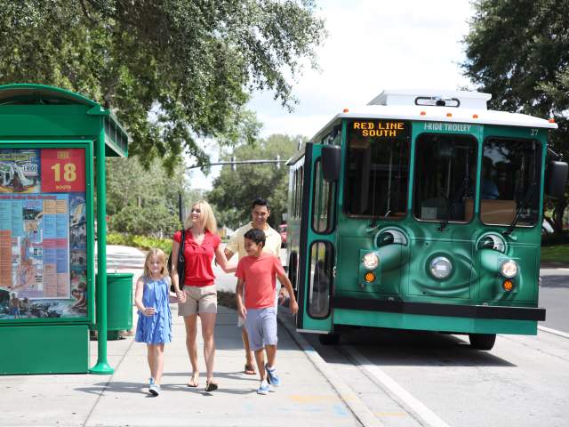 I-Ride Trolley Services family at bus stop