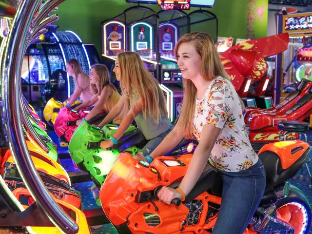 A group of young people enjoying Carlisle Sports Emporium's indoor arcade.