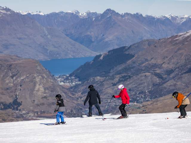 Coronet Peak Family ski lesson on a bluebird winters day