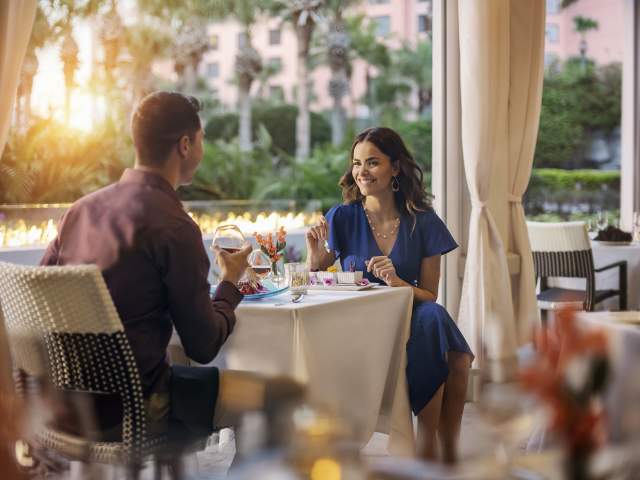 Couple dining on patio of The Venetian Chophouse at Caribe Royale Orlando