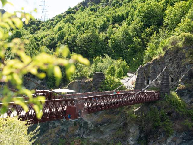 Bikers travelling over the Kawarau Suspension Bridge