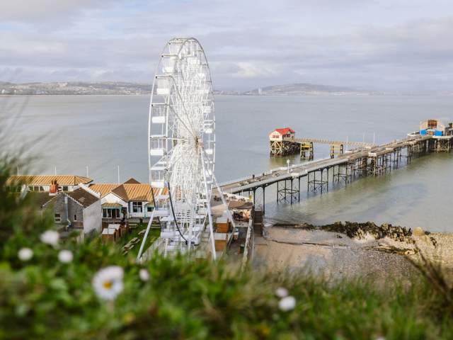 Large Ferris wheel next to Mumbles pier