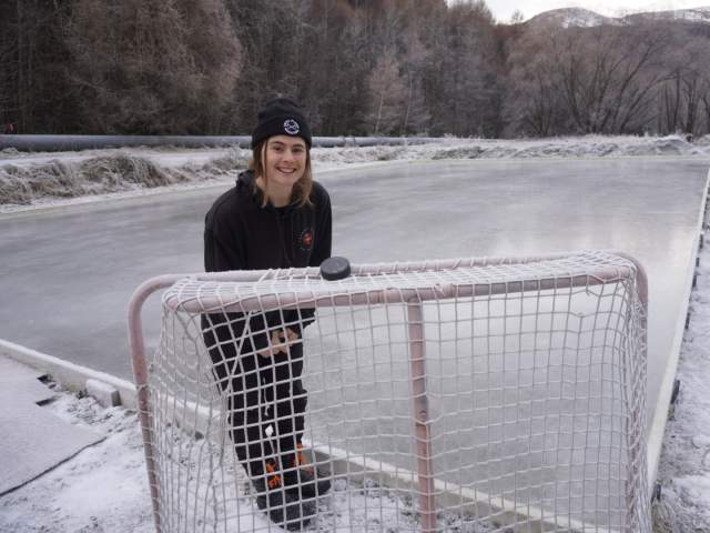 Person standing in front of icerink