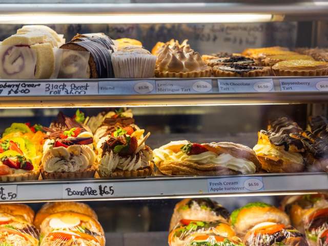 View of bakery cabinet with lots of treats