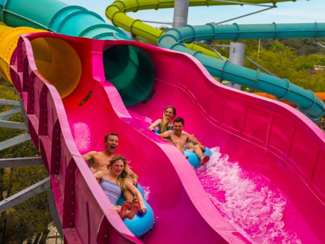 Two pairs of friends on waterslide