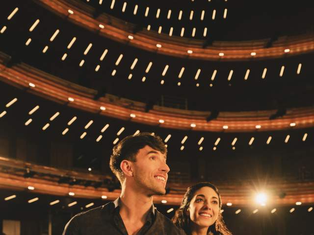 A romantic couple enjoy a show at Steinmetz theater