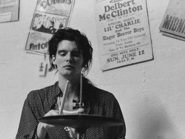Black and white photo of Charlie Sexton playing cymbals