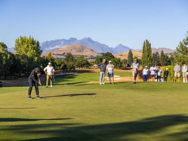 People putting on a golf green at the NZ Golf Open 2025, Millbrook Resort