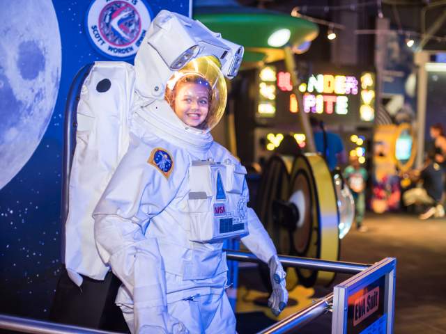 WonderWorks girl in astronaut suit