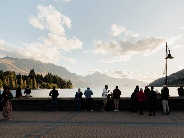Queenstown Bay at dusk with mountains in the background