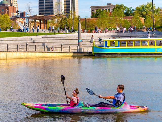 Dad and daughter kayaking on the St. Marys River at Promenade Park in Fort Wayne
