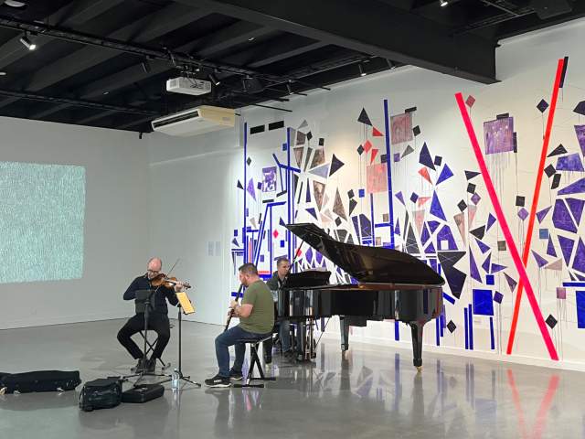 Musicians playing at Lyric and Lines Exhibition Te Atamira