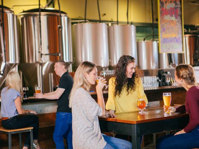 Girlfriends enjoying beer at Ever Grain Brewing.