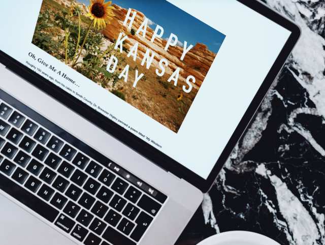 Image of a Kansas Day graphic on a lap top