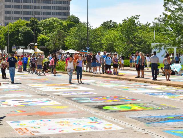 people looking at chalk walk street art