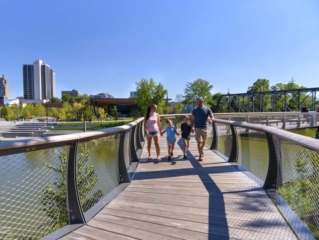 Family walking on the Tree Canopy Trail at Promenade Park