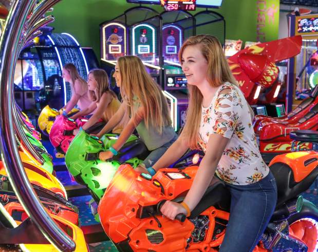 A group of young people enjoying Carlisle Sports Emporium's indoor arcade.
