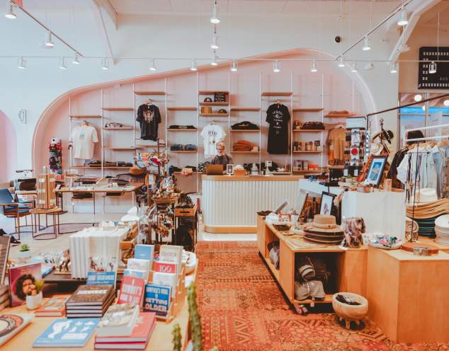 Modern clothing and merchandise displays at the Austin Visitor Center.