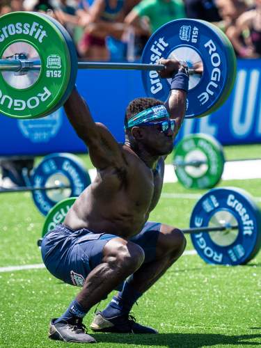 Athlete Chandler Smith at the bottom of an overhead squat at the 2019 CrossFit Games