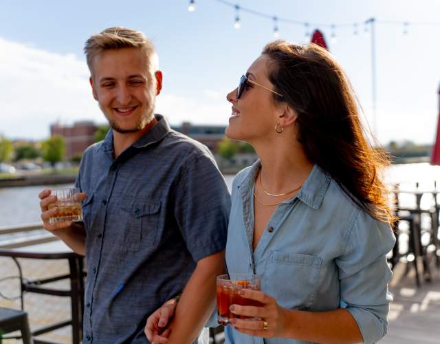 Couple walking outside of Waterfront Wine Bar in Manitowoc Wisconsin