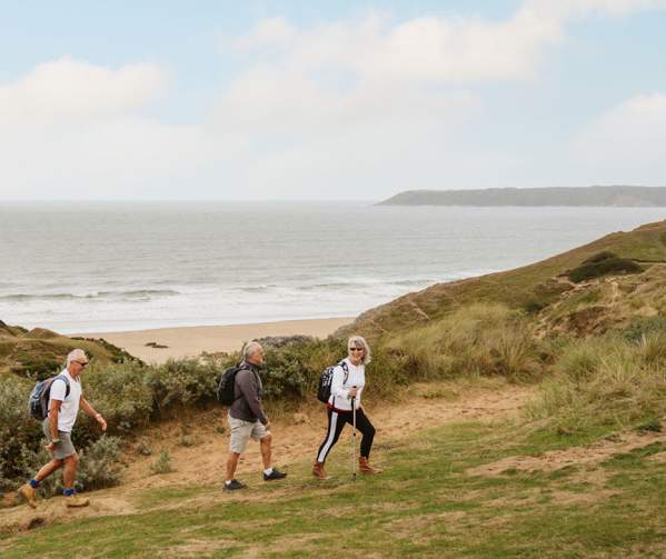 3 walkers in sand dunes