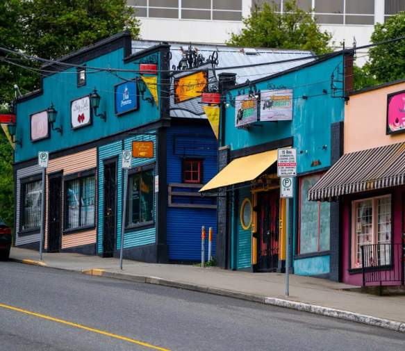 A row of colourful shops.