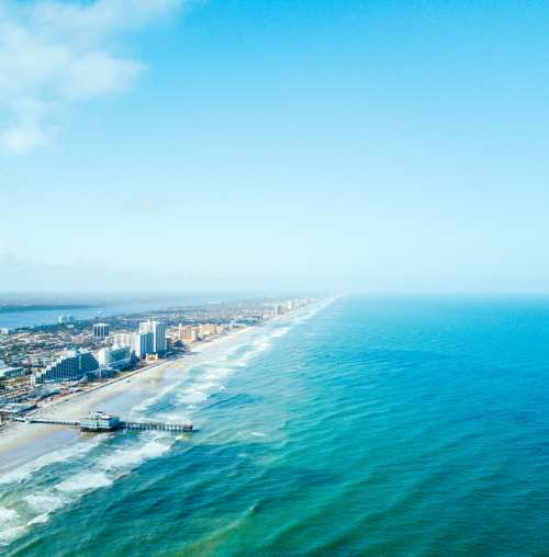 aerial view of daytona beach that includes the city and ocean