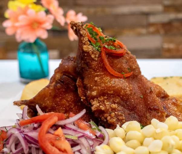 A dish with meat and corn.