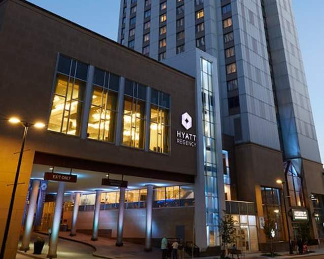 An image of the outside of the Hyatt Regency in downtown Rochester at dawn
