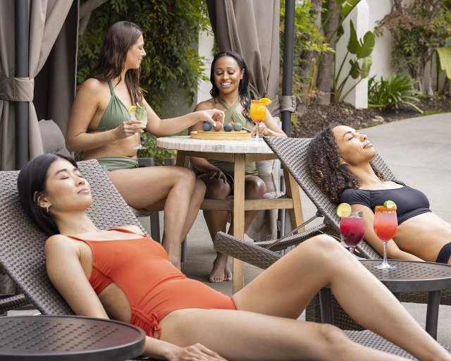 Four women relaxing in a cabana at Glen Ivy Hot Springs in Corona, CA
