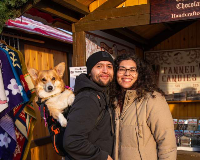 Visitors to Christkindlmarket Aurora at RiverEdge Park in Aurora, Illinois