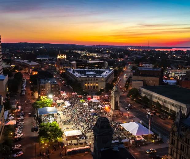 Drone image of sunset over NYS Blues Festival in Clinton Square Syracuse