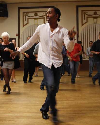 People dancing salsa at Salsa Caliente Dance Studio, in Tampa’s Ybor City