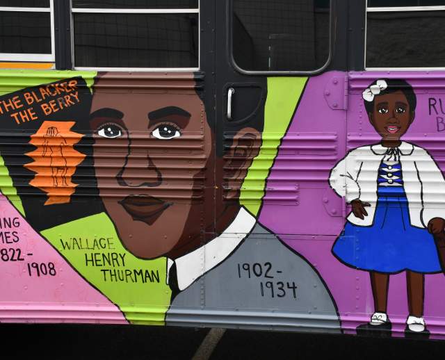 Murals on the side of the Utah Black History Museum bus